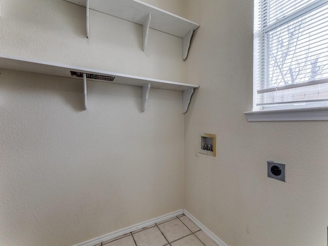 7116 Park Creek Cir E, Fort Worth, TX 76137 - washroom with hookup for a washing machine, electric dryer hookup, baseboards, and light tile patterned floors