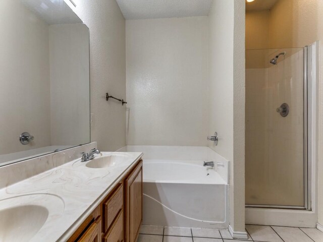 7116 Park Creek Cir E, Fort Worth, TX 76137 - bathroom featuring a shower stall, a garden tub, tile patterned floors, and double vanity