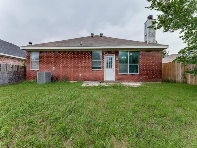 7116 Park Creek Cir E, Fort Worth, TX 76137 - back of house with a chimney, cooling unit, and brick siding