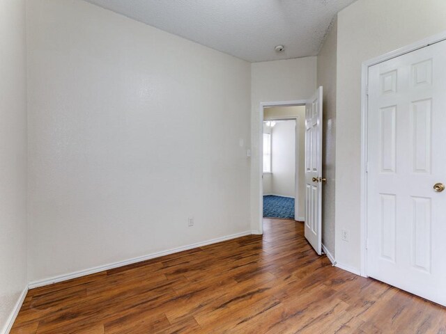 7116 Park Creek Cir E, Fort Worth, TX 76137 - unfurnished room featuring wood finished floors and baseboards