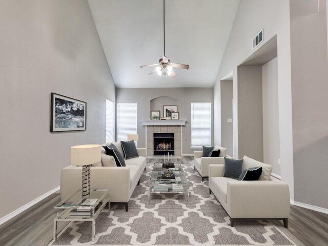 9736 Old Field Dr, Mckinney, TX 75072 - living area featuring wood finished floors, a ceiling fan, baseboards, a fireplace, and high vaulted ceiling