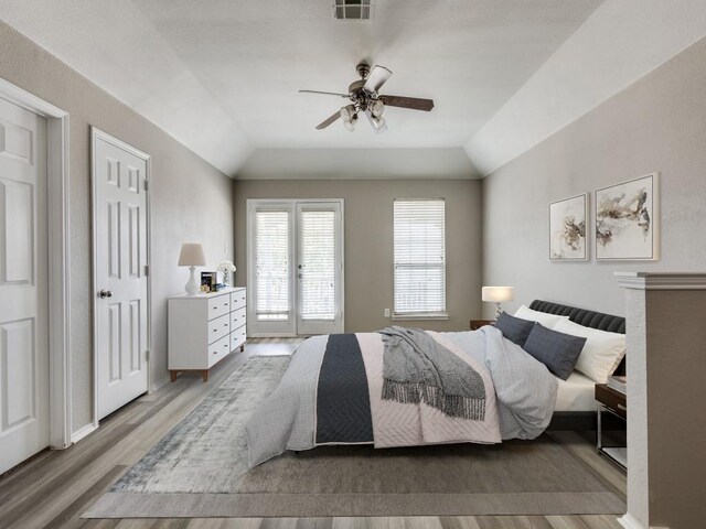 9736 Old Field Dr, Mckinney, TX 75072 - bedroom featuring wood finished floors, vaulted ceiling, and ceiling fan