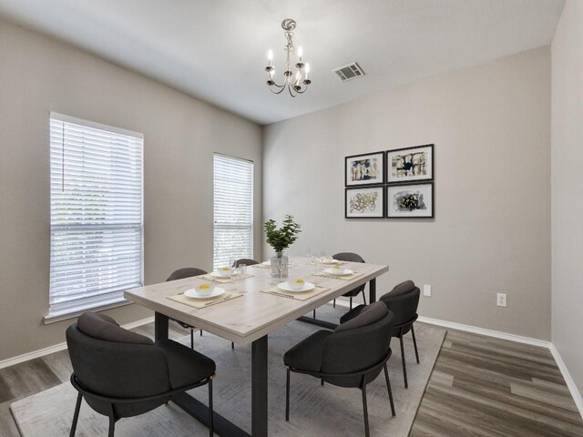 9736 Old Field Dr, Mckinney, TX 75072 - dining room with a chandelier, wood finished floors, healthy amount of natural light, and baseboards