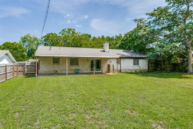 1816 Chattanooga, Bedford, TX 76021 - rear view of property featuring brick siding, a chimney, and a patio area