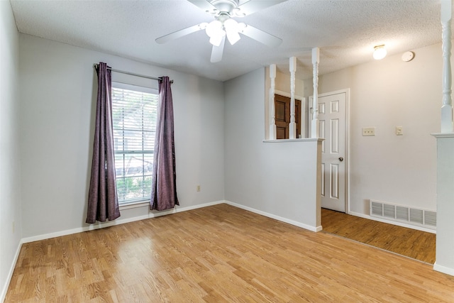 1816 Chattanooga, Bedford, TX 76021 - empty room featuring light wood-style floors, ceiling fan, baseboards, and a textured ceiling