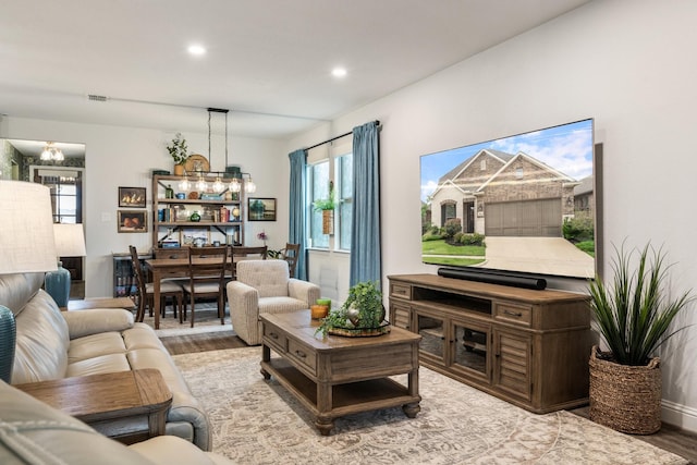 1615 Sweetwater Way, Celina, TX 75009 - living room with wood finished floors, recessed lighting, and a chandelier