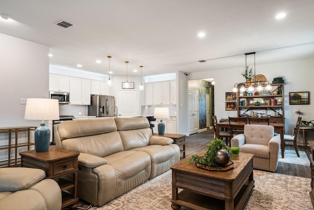 1615 Sweetwater Way, Celina, TX 75009 - living room featuring wood finished floors and recessed lighting