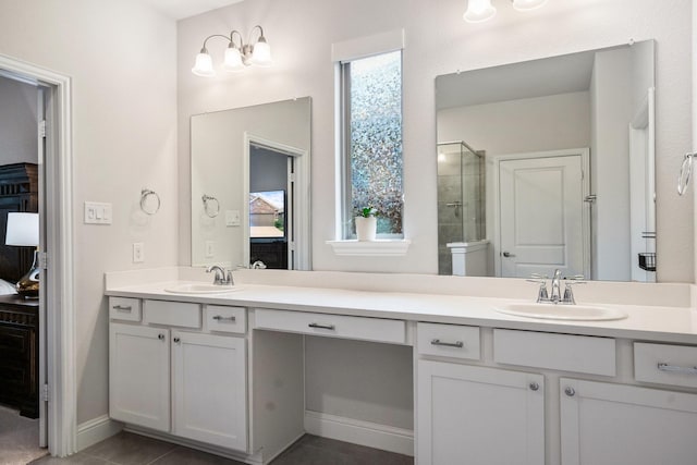 1615 Sweetwater Way, Celina, TX 75009 - ensuite bathroom featuring a shower stall, double vanity, and tile patterned floors
