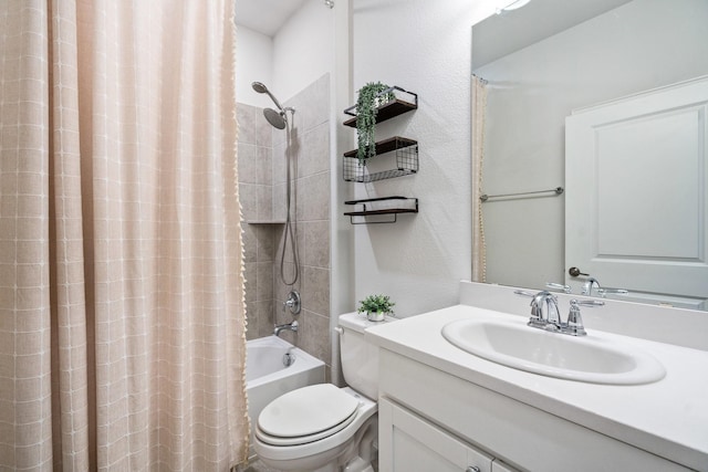 1615 Sweetwater Way, Celina, TX 75009 - bathroom with vanity, toilet, shower / bath combo with shower curtain, and a textured wall