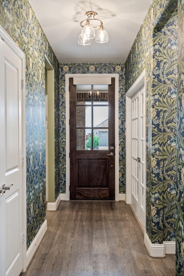 1615 Sweetwater Way, Celina, TX 75009 - entrance foyer featuring wallpapered walls, wood finished floors, baseboards, and a chandelier