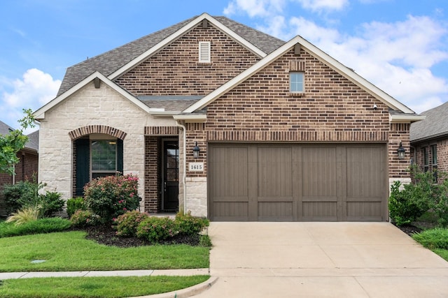 1615 Sweetwater Way, Celina, TX 75009 - french country inspired facade featuring roof with shingles, concrete driveway, brick siding, a garage, and stone siding