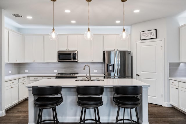 1615 Sweetwater Way, Celina, TX 75009 - kitchen with appliances with stainless steel finishes, a sink, tasteful backsplash, an island with sink, and recessed lighting