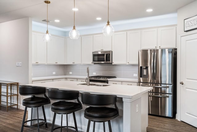1615 Sweetwater Way, Celina, TX 75009 - kitchen featuring stainless steel appliances, tasteful backsplash, dark wood finished floors, and recessed lighting