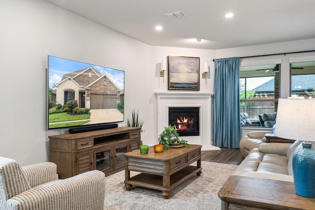 1615 Sweetwater Way, Celina, TX 75009 - living room featuring wood finished floors, a glass covered fireplace, and recessed lighting