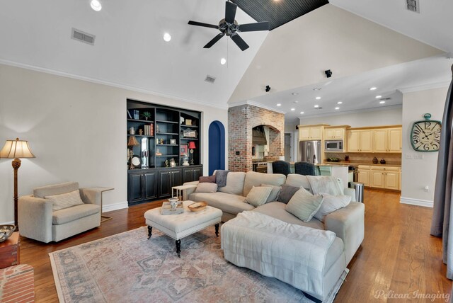 105 Esplanade Ct, Bossier City, LA 71111 - living room featuring arched walkways, a ceiling fan, recessed lighting, high vaulted ceiling, and light wood-style floors