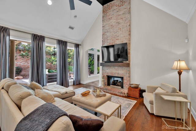 105 Esplanade Ct, Bossier City, LA 71111 - living room with a ceiling fan, a brick fireplace, high vaulted ceiling, baseboards, and recessed lighting