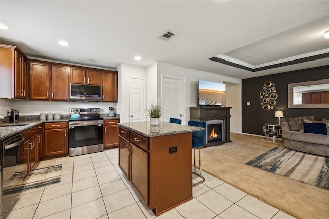 2224 Heaton St, Forney, TX 75126 - kitchen with stainless steel appliances, open floor plan, a sink, light carpet, and light tile patterned flooring