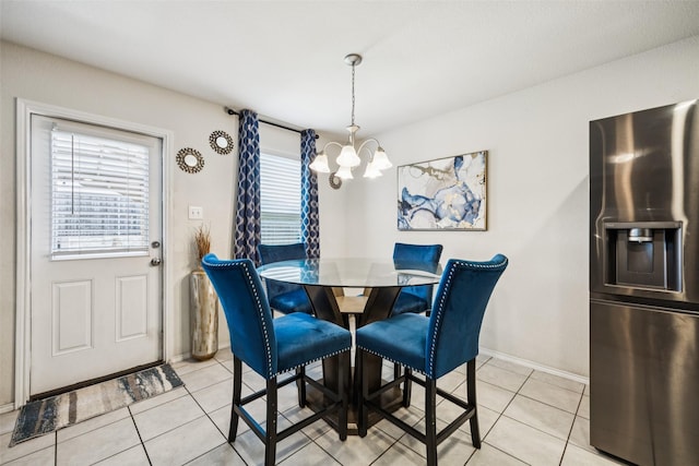 2224 Heaton St, Forney, TX 75126 - dining room featuring a chandelier, light tile patterned flooring, and baseboards