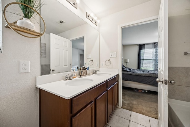2224 Heaton St, Forney, TX 75126 - ensuite bathroom featuring tile patterned floors, double vanity, and a bathtub