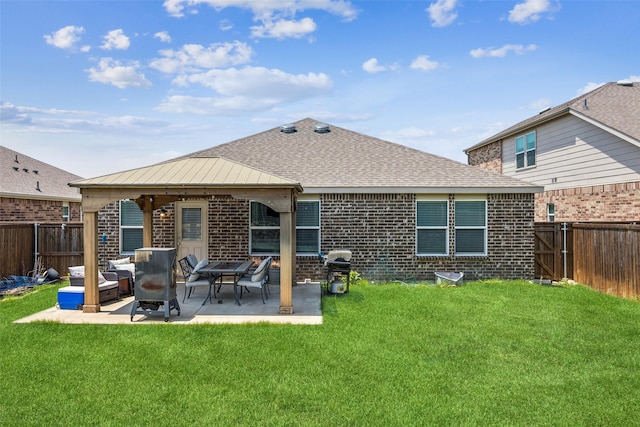 2224 Heaton St, Forney, TX 75126 - back of property with a shingled roof, brick siding, and a patio