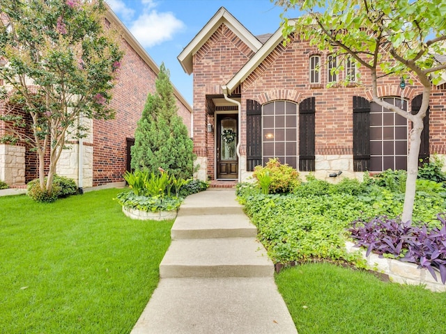 4344 Kestrel Way, Carrollton, TX 75010 - view of front of property with brick siding and a front yard