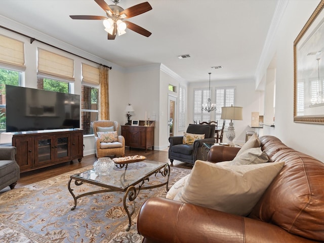 6301 Bermuda Dunes Dr, Plano, TX 75093 - living area featuring a chandelier, wood finished floors, a ceiling fan, and ornamental molding