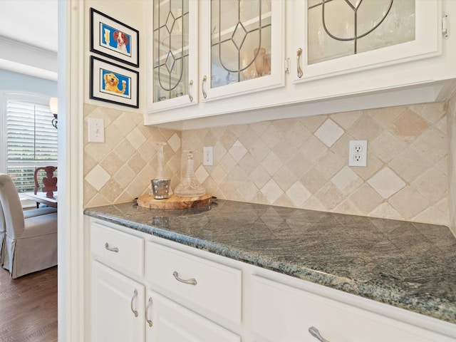 6301 Bermuda Dunes Dr, Plano, TX 75093 - kitchen with glass insert cabinets, dark wood-style flooring, white cabinets, and decorative backsplash
