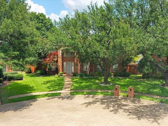 6301 Bermuda Dunes Dr, Plano, TX 75093 - view of property hidden behind natural elements with brick siding