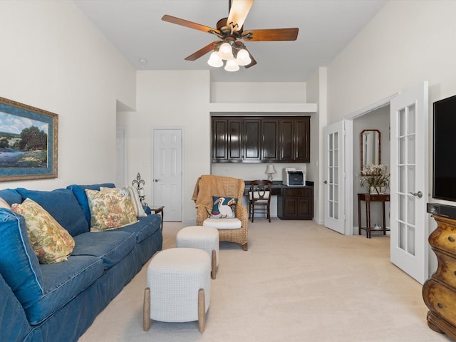 6301 Bermuda Dunes Dr, Plano, TX 75093 - living area with french doors, light colored carpet, ceiling fan, and a towering ceiling