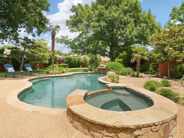 6301 Bermuda Dunes Dr, Plano, TX 75093 - view of swimming pool featuring a pool with connected hot tub, a fenced backyard, and a patio