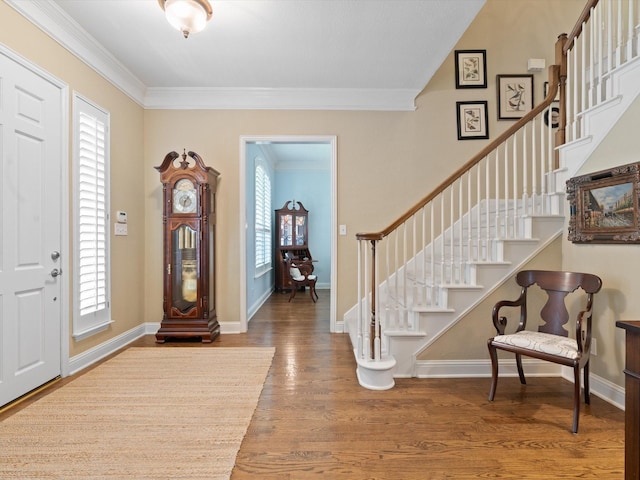 6301 Bermuda Dunes Dr, Plano, TX 75093 - foyer entrance featuring healthy amount of natural light, stairs, wood finished floors, and crown molding