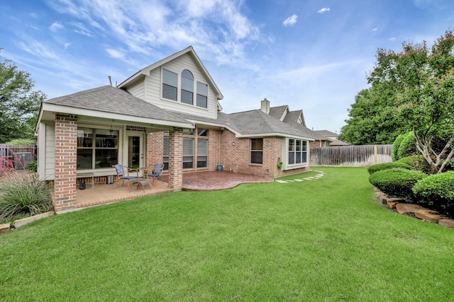 9708 Sinclair St, Fort Worth, TX 76244 - back of property featuring brick siding, a patio, a shingled roof, and a chimney