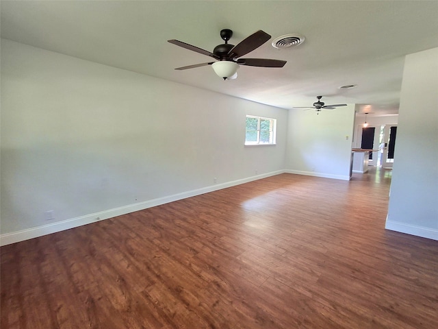 3717 W Spurgeon St, Fort Worth, TX 76133 - unfurnished room featuring dark wood finished floors, baseboards, and a ceiling fan