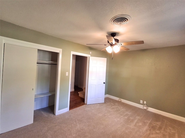 3717 W Spurgeon St, Fort Worth, TX 76133 - unfurnished bedroom featuring light carpet, baseboards, a ceiling fan, a closet, and a textured ceiling