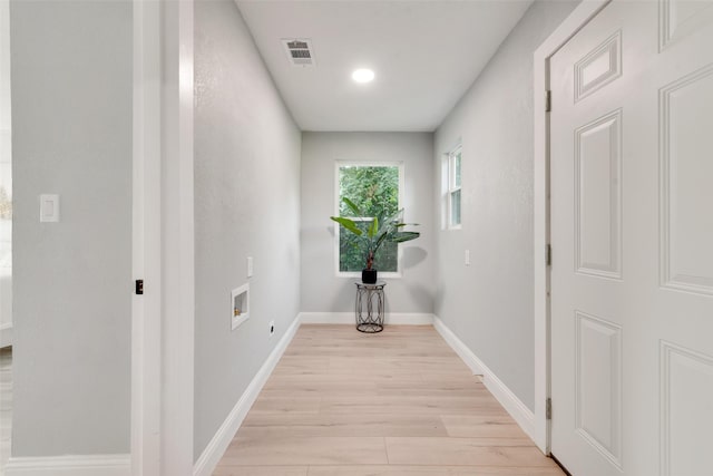 228 Harrison Ln, Hurst, TX 76053 - hall featuring light wood-style floors and baseboards