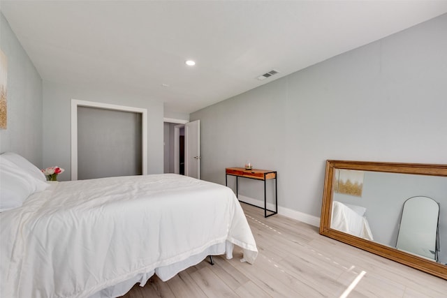 228 Harrison Ln, Hurst, TX 76053 - bedroom with light wood-style floors, baseboards, and recessed lighting
