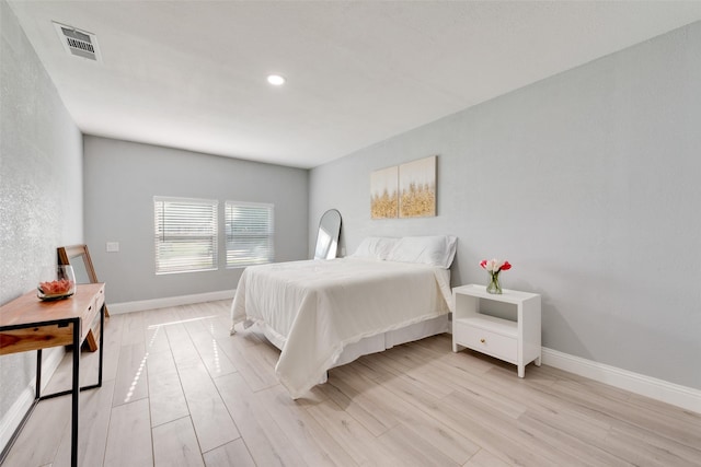 228 Harrison Ln, Hurst, TX 76053 - bedroom featuring light wood-type flooring, baseboards, and recessed lighting