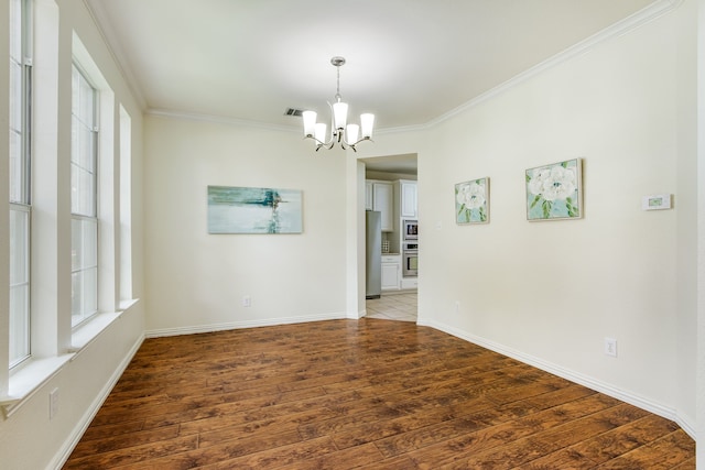 2001 Bosbury Dr, Flower Mound, TX 75028 - empty room with a chandelier, wood finished floors, crown molding, and baseboards