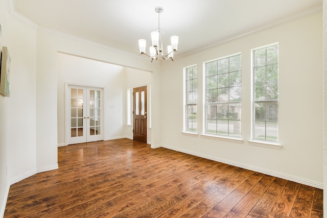 2001 Bosbury Dr, Flower Mound, TX 75028 - empty room with dark wood-style floors, plenty of natural light, ornamental molding, a chandelier, and french doors