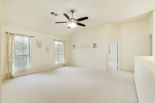 2001 Bosbury Dr, Flower Mound, TX 75028 - spare room with light colored carpet, vaulted ceiling, a ceiling fan, and baseboards