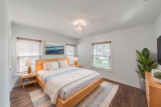 8726 San Fernando Way, Dallas, TX 75218 - bedroom featuring dark wood-style floors and baseboards