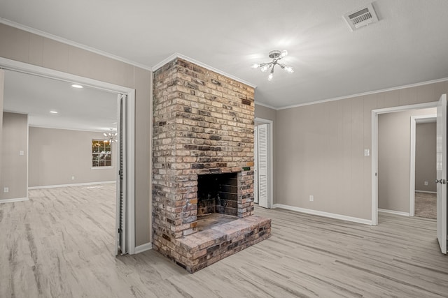 2216 Archer Trl, Denton, TX 76209 - unfurnished living room with light wood-style flooring, a chandelier, crown molding, baseboards, and a fireplace
