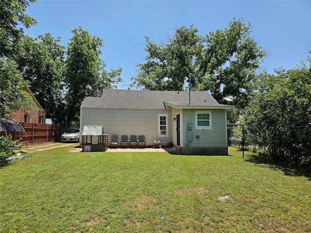 203 Hollywood St, Coleman, TX 76834 - back of property with a patio area