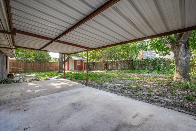 612 Meadow Ln, Roanoke, TX 76262 - fenced backyard featuring a patio, a shed, and a carport