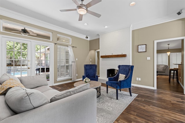 7009 Brookvale Rd, Fort Worth, TX 76132 - living room featuring ceiling fan, crown molding, wood finished floors, a brick fireplace, and recessed lighting