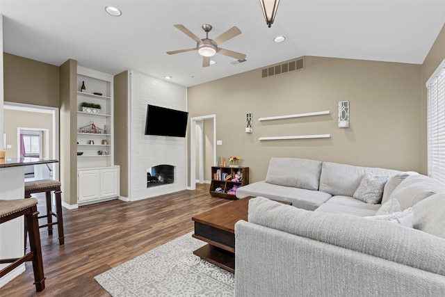 7009 Brookvale Rd, Fort Worth, TX 76132 - living room featuring ceiling fan, dark wood-style flooring, a fireplace, and recessed lighting