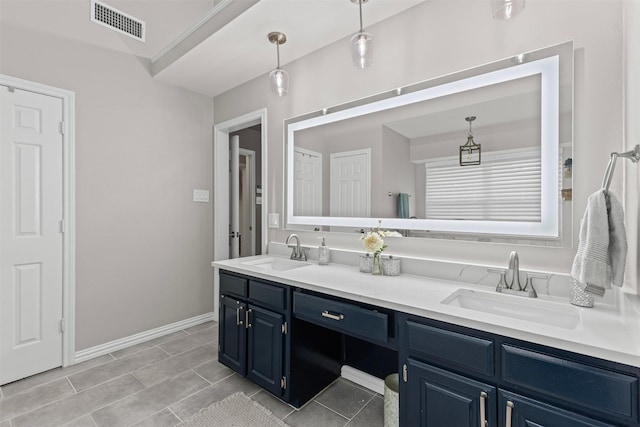 7009 Brookvale Rd, Fort Worth, TX 76132 - bathroom with double vanity and baseboards