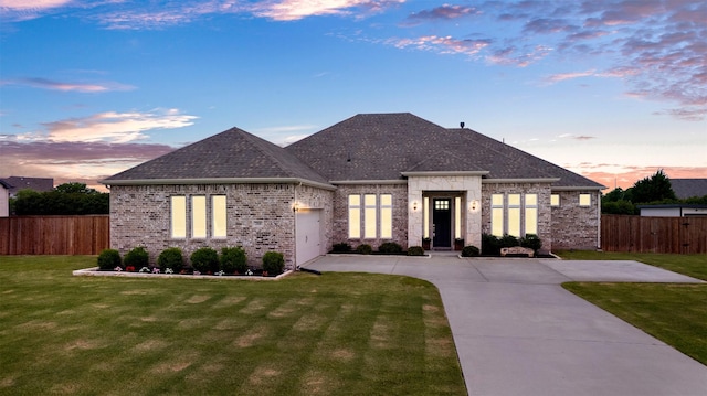 288 Ontario Loop, Sunnyvale, TX 75182 - french country home with concrete driveway, brick siding, an attached garage, and roof with shingles