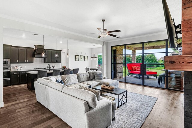 288 Ontario Loop, Sunnyvale, TX 75182 - living room featuring a ceiling fan, crown molding, and dark wood finished floors