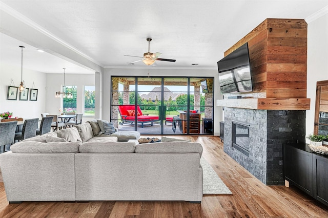 288 Ontario Loop, Sunnyvale, TX 75182 - living area with healthy amount of natural light, a ceiling fan, crown molding, and wood finished floors